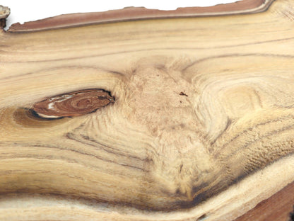 A detailed close-up of a black locust wood slab shows the intricate grain around a knot.