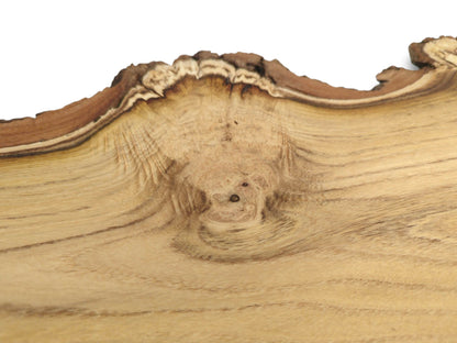 A close-up of a black locust slab shows grain flowing from a knot to the live edge.