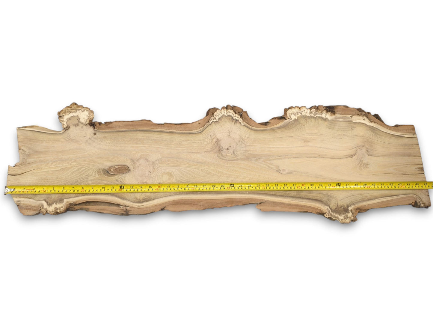 A top-down view of the entire black locust slab with a measuring tape for scale.