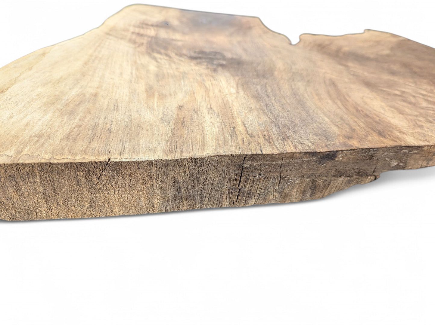 Organic brown wood slice, showing a light top surface with grain, and a dark, rough, cracked side.