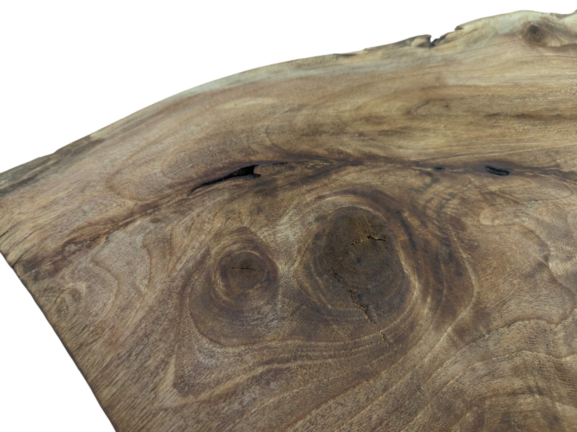 Close-up of a natural wood slab with prominent grain patterns, knots, and a live edge.