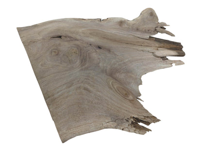 Overhead view of a natural walnut wood slab with a live edge and visible grain.