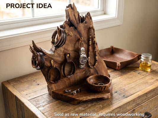 A rustic walnut root wood slice crafted into a jewelry stand with a live edge.