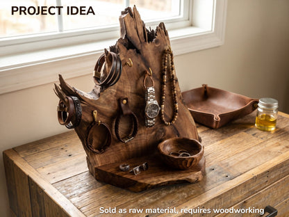 A rustic walnut root wood slice crafted into a jewelry stand with a live edge.