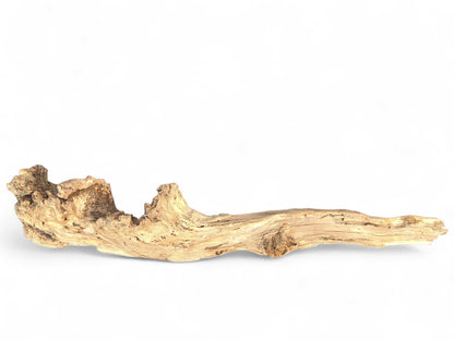 Rough, textured, light brown driftwood sculpture with gnarled sections, irregular shape, on white background.