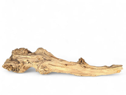 A light brown, weathered driftwood piece with an irregular gnarled shape and rough texture on a white background.
