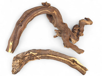 Curved, gnarled dark brown grapevine driftwood pieces with exposed light tan wood grain on white.