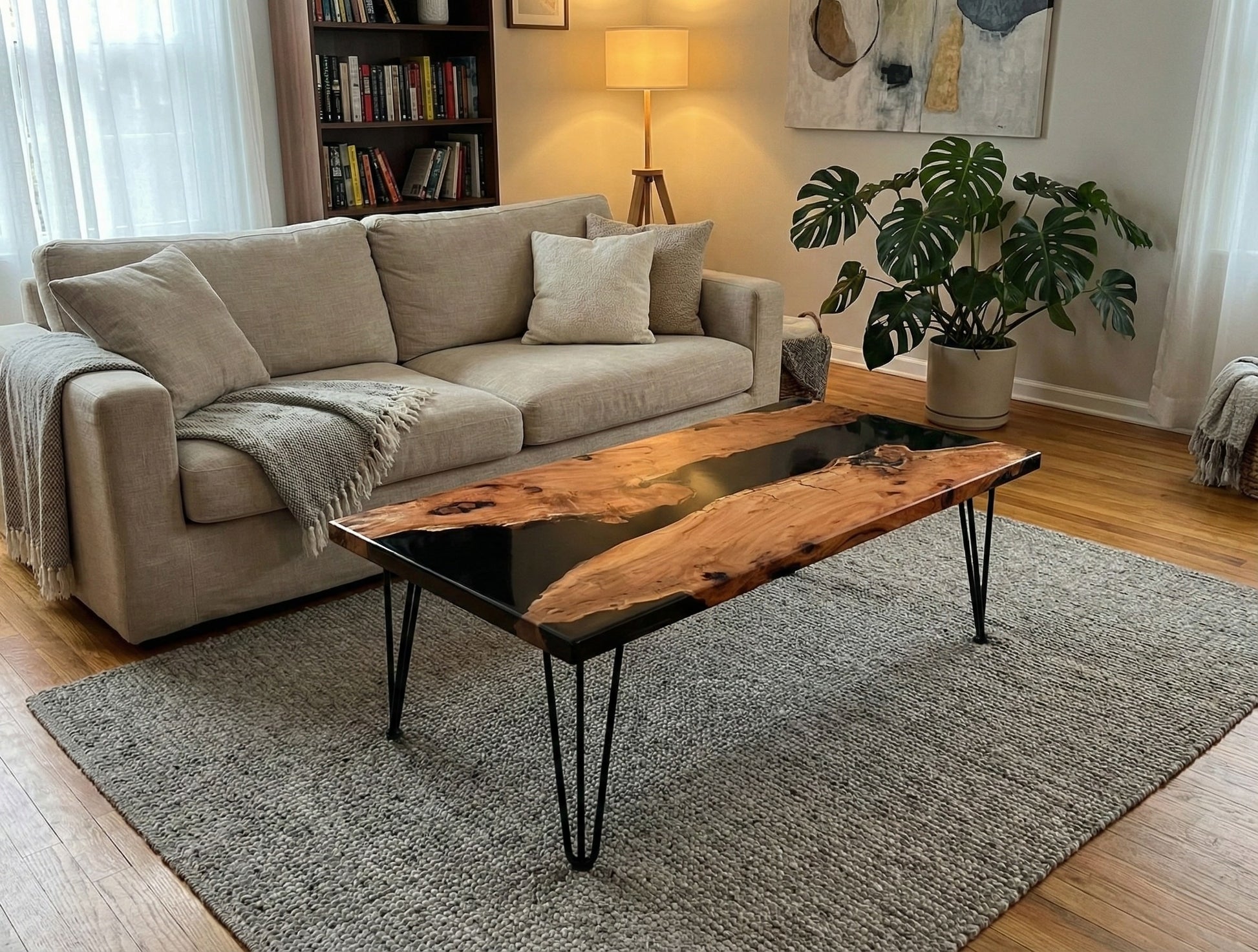 Table featuring light brown, irregularly textured wood with dark resin inlay and black hairpin legs.