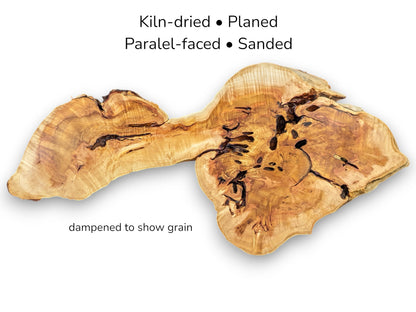 Light brown, irregularly shaped live edge wood slab with text describing kiln-drying, planing, and sanding.