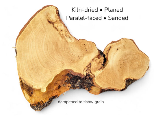 Irregular light golden wood slice with dark bark edges and text listing processing details on white.