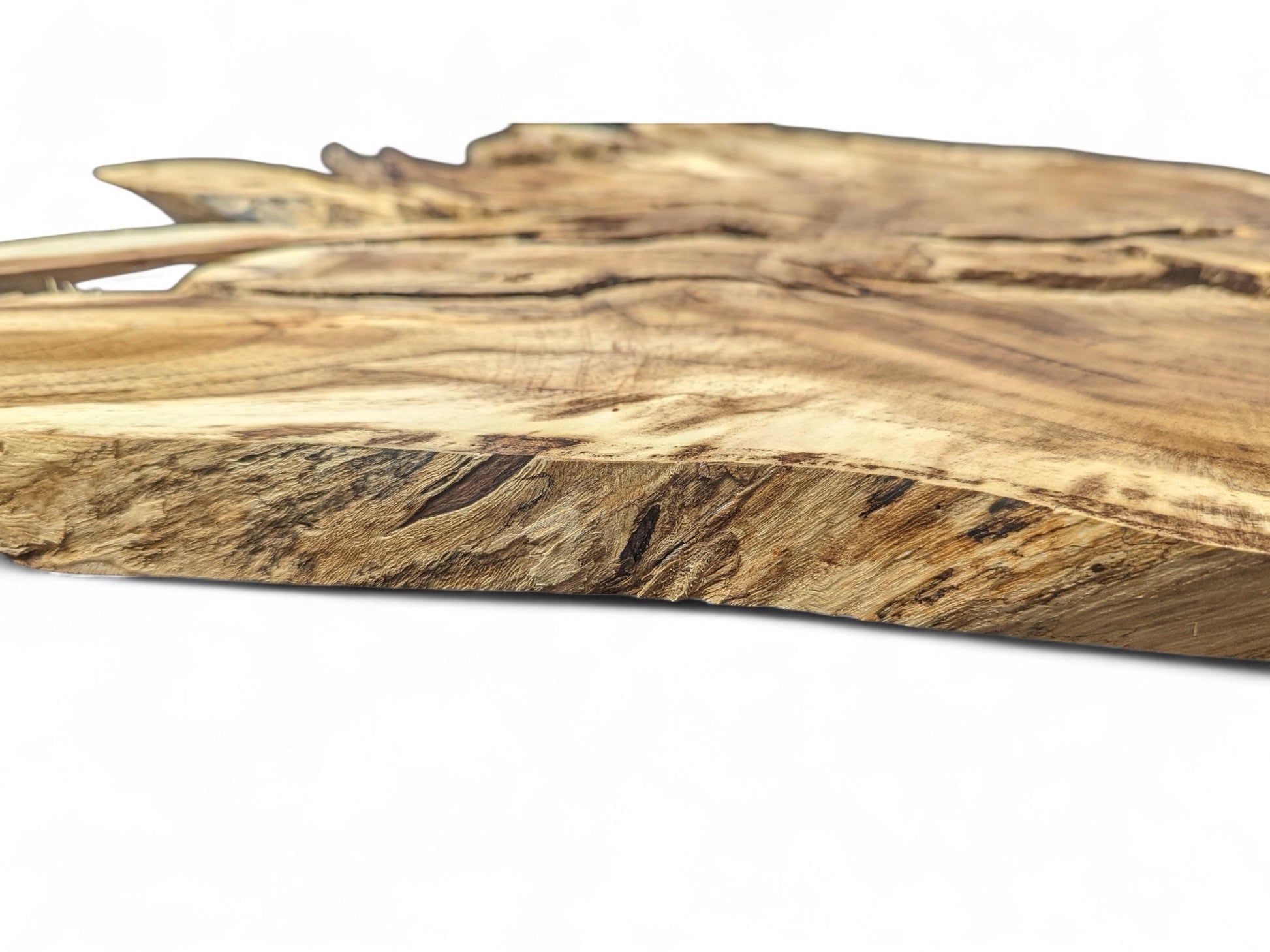 Organic-shaped root wood slice with a natural live edge, showing brown tones, intricate grain, and surface cracks.