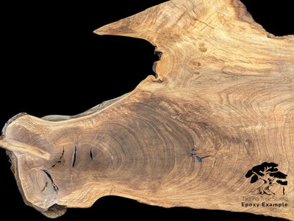 Live edge English walnut root wood slice, light brown, with grain, cracks, and 'Epoxy Example' text.