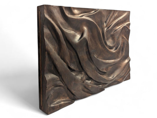 Rectangular solid walnut panel with dark brown, deeply carved fabric-like folds, finished with natural oils.